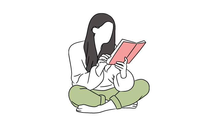 座って読書する女性